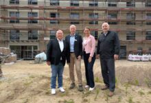 a group of people standing in front of a building